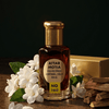 Attar Motia 1460 bottle with jasmine flowers and sandalwood, showcasing attars with sandalwood and jasmine.
