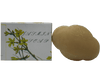 Vegan jasmine soap in a unique shape alongside its packaging featuring jasmine flowers.