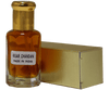 Kesar Chandan perfume showcasing a sandalwood saffron blend in a glass bottle with a gold cap.