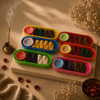 Rangoli incense gift set featuring 60 colorful cones in various fragrances displayed with incense holders.