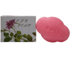 Handmade rose bathing soap in a pink cloud shape beside its box featuring rose design.