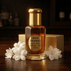 Ruh Chameli jasmine fragrance bottle beside fresh jasmine flowers on a wooden table.