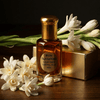 Ruh Rajnigandha pure tuberose distillate extract bottle with white flowers, showcasing elegance and fragrance.